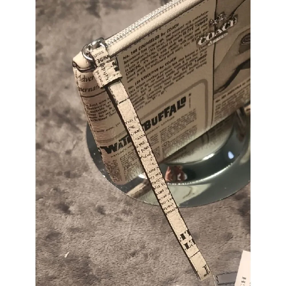 Coach Beige Newspaper Print Zip Wristlet